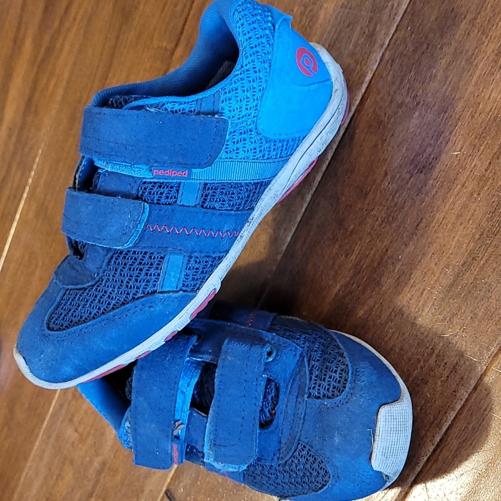Blue tennis shoes. Pediped.
